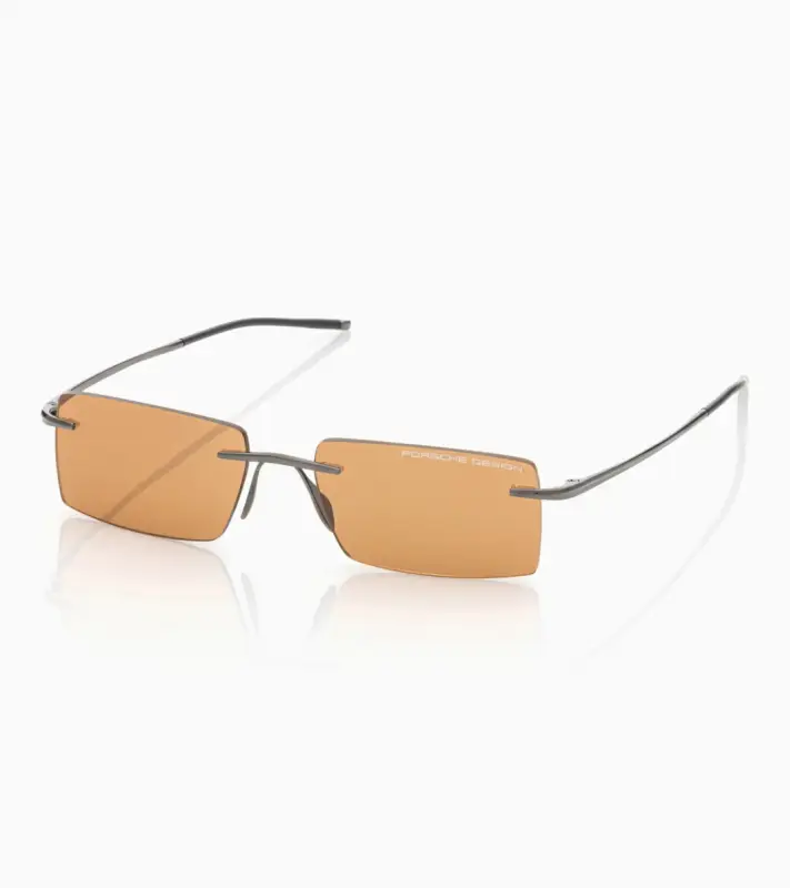 PORSCHE DESIGN P´86018 Sunglasses Liquid Titanium #8 Sluneční brýle bezrámečkové uni šedé se světle oranžovými skly