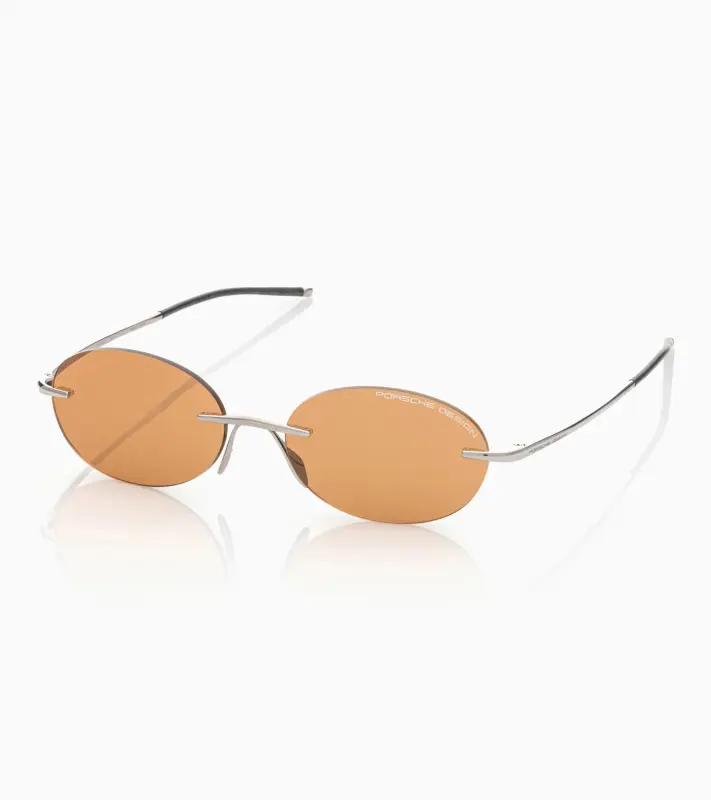 PORSCHE DESIGN P´86017 Sunglasses Liquid Titanium #7 Sluneční brýle bezrámečkové uni v barvě palladium se světle oranžovými skly