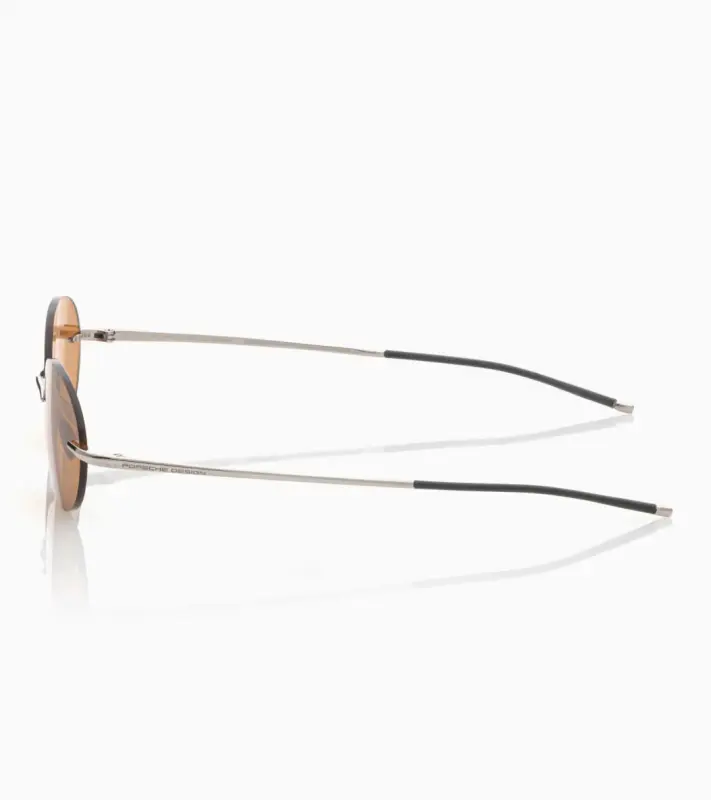 PORSCHE DESIGN P´86017 Sunglasses Liquid Titanium #7 Sluneční brýle bezrámečkové uni v barvě palladium se světle oranžovými skly