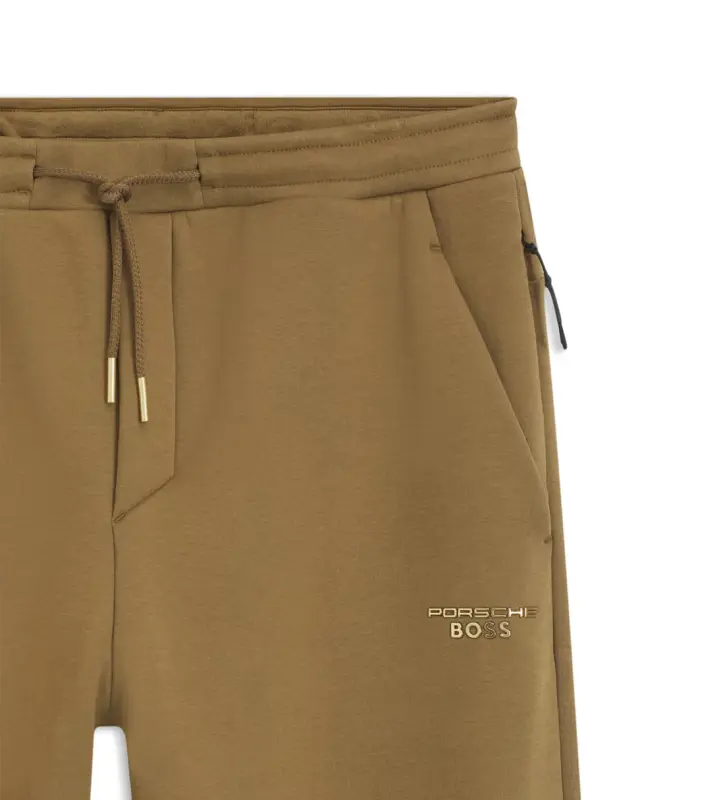 PORSCHE DESIGN Stretch-Jersey Tracksuit Bottoms with logo Porsche x BOSS  Kalhoty volnočasové sportovní mírně strečové s náplety v hnědé camelce