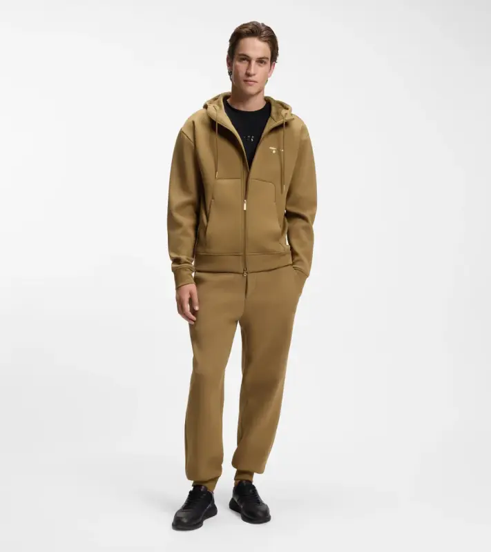 PORSCHE DESIGN Stretch-Jersey Tracksuit Bottoms with logo Porsche x BOSS  Kalhoty volnočasové sportovní mírně strečové s náplety v hnědé camelce