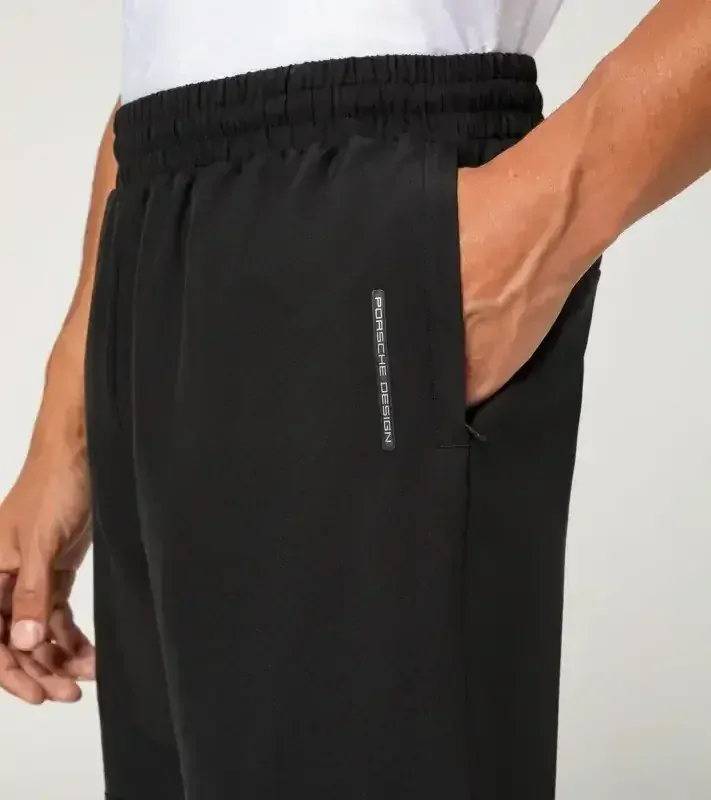 PORSCHE DESIGN Woven tech trousers Kalhoty sportovní funkční elastické černá