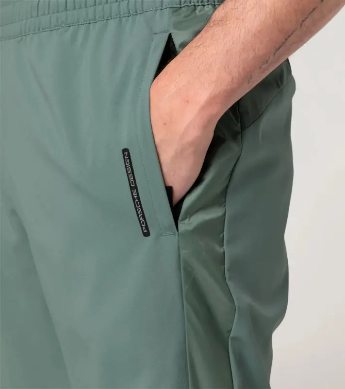 PORSCHE DESIGN Woven Tech Trousers Kalhoty tkané volnočasové sportovní mátová zelená