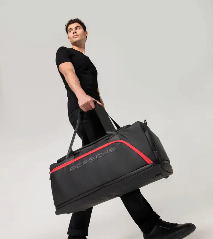 PORSCHE Urban Travel Duffle Bag Taška cestovní sportovní s nastavitelnou délkou černá s logem a červeným potiskem uvnitř