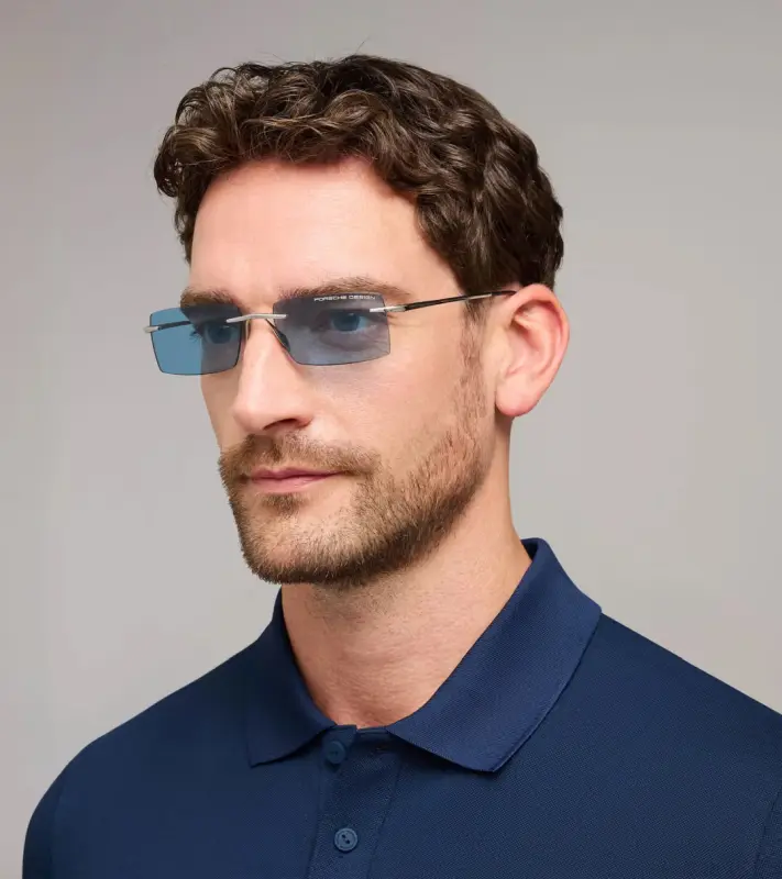 PORSCHE DESIGN P´86018 Sunglasses Liquid Titanium #8 Sluneční brýle bezrámečkové uni v barvě palladium se světle modrými skly