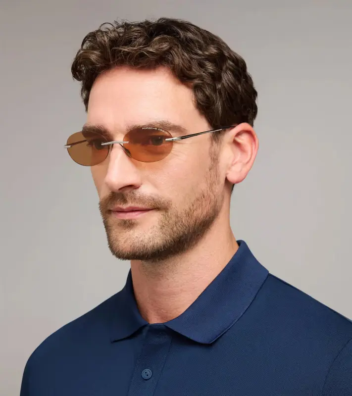 PORSCHE DESIGN P´86017 Sunglasses Liquid Titanium #7 Sluneční brýle bezrámečkové uni v barvě palladium se světle oranžovými skly