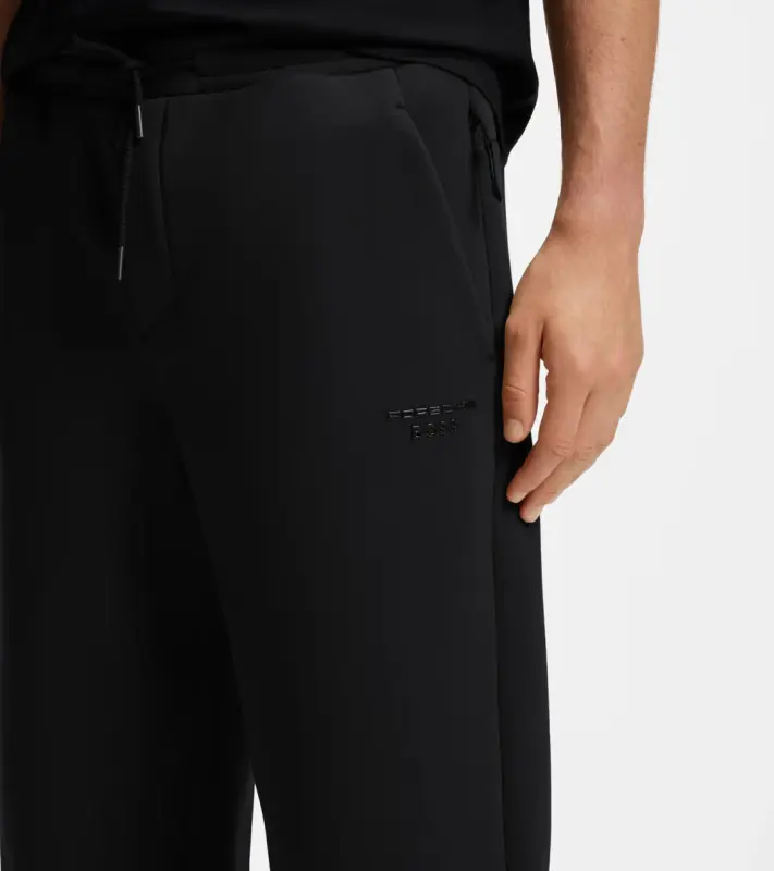 PORSCHE DESIGN Stretch-Jersey Tracksuit Bottoms with logo Porsche x BOSS Kalhoty volnočasové sportovní mírně strečové s náplety v černé