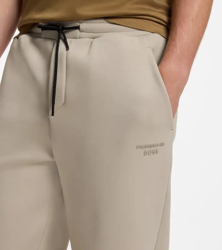 PORSCHE DESIGN Stretch-Jersey Tracksuit Bottoms with logo Porsche x BOSS Kalhoty volnočasové sportovní mírně strečové s náplety v béžové