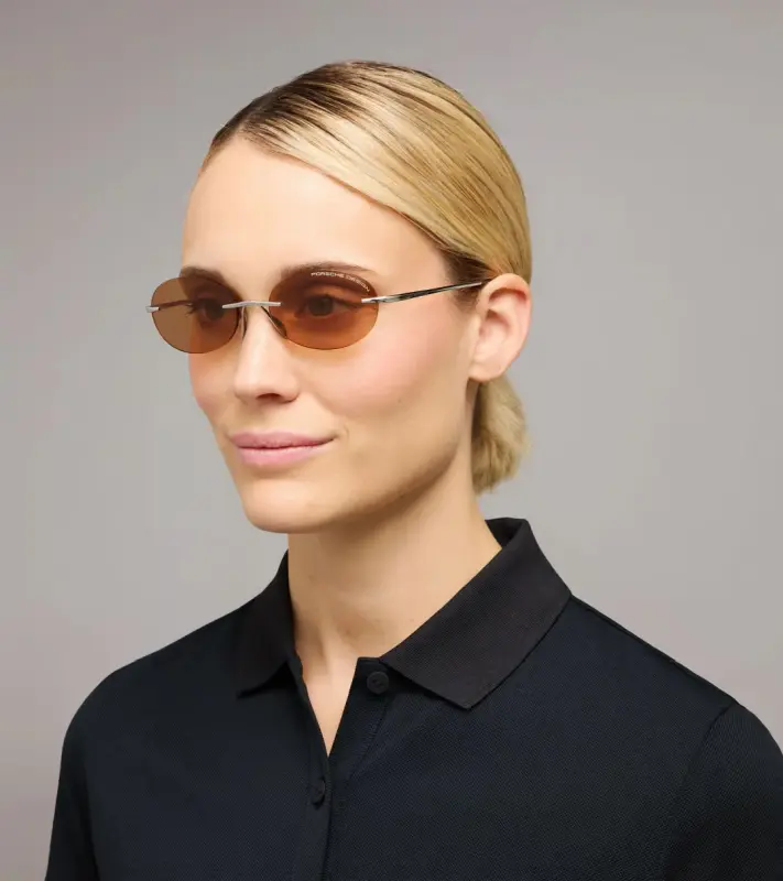 PORSCHE DESIGN P´86017 Sunglasses Liquid Titanium #7 Sluneční brýle bezrámečkové uni v barvě palladium se světle oranžovými skly