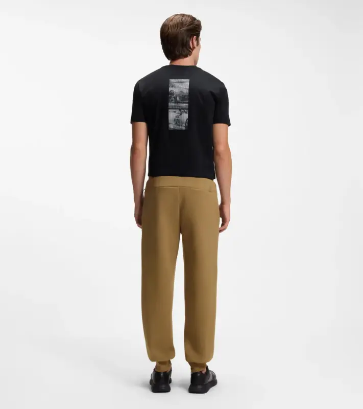 PORSCHE DESIGN Stretch-Jersey Tracksuit Bottoms with logo Porsche x BOSS  Kalhoty volnočasové sportovní mírně strečové s náplety v hnědé camelce