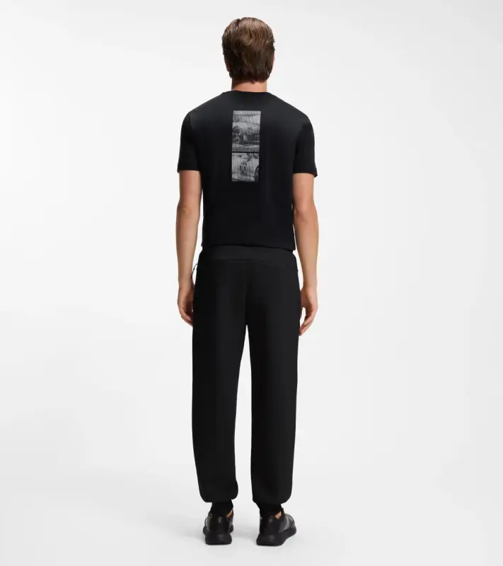 PORSCHE DESIGN Stretch-Jersey Tracksuit Bottoms with logo Porsche x BOSS Kalhoty volnočasové sportovní mírně strečové s náplety v černé
