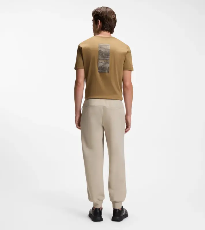 PORSCHE DESIGN Stretch-Jersey Tracksuit Bottoms with logo Porsche x BOSS Kalhoty volnočasové sportovní mírně strečové s náplety v béžové